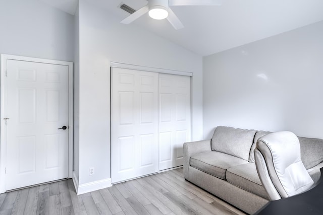 sitting room with vaulted ceiling, light hardwood / wood-style floors, and ceiling fan