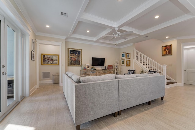 living area featuring visible vents, coffered ceiling, a ceiling fan, stairway, and light wood-type flooring