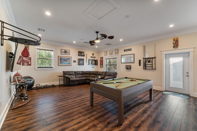 game room with ornamental molding, dark wood-style flooring, visible vents, and baseboards