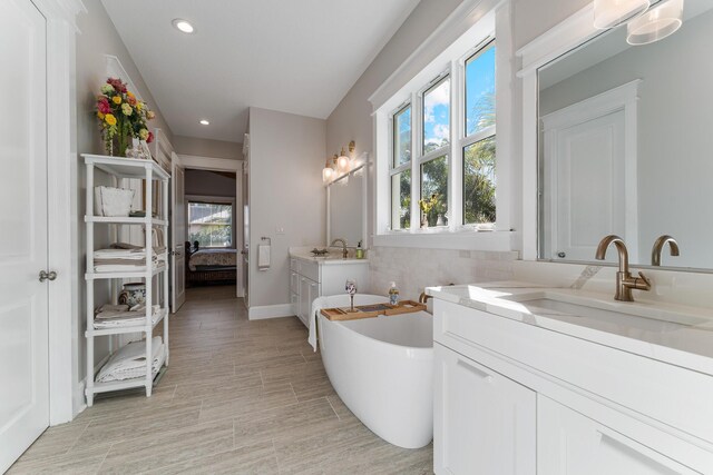 bathroom featuring vanity, decorative backsplash, and plus walk in shower