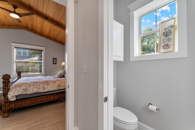 bathroom with hardwood / wood-style flooring, lofted ceiling, toilet, and wooden ceiling