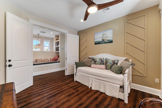 sitting room with visible vents, baseboards, ceiling fan, and dark wood-style flooring