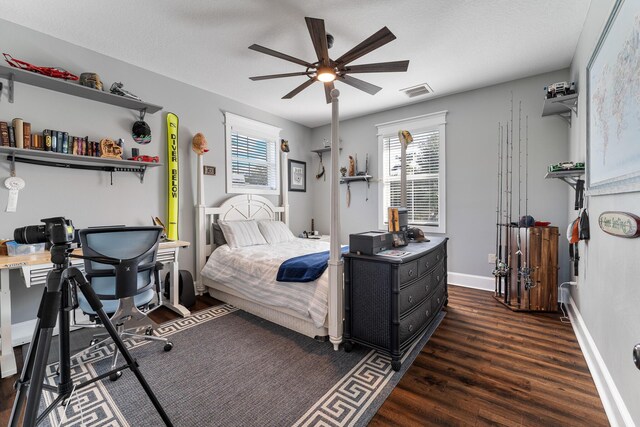 living area with ceiling fan and dark hardwood / wood-style flooring