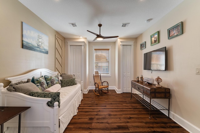 living room with ceiling fan and dark hardwood / wood-style flooring