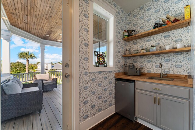 laundry room with separate washer and dryer and cabinets