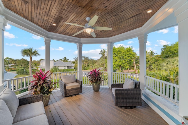 wooden terrace featuring ceiling fan