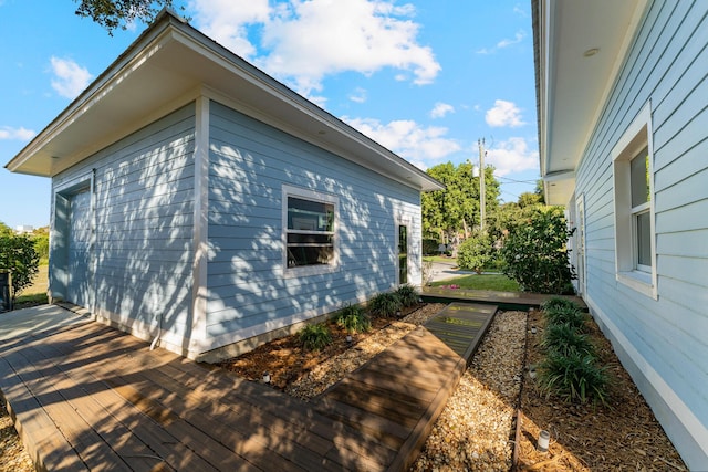 view of property exterior with a deck