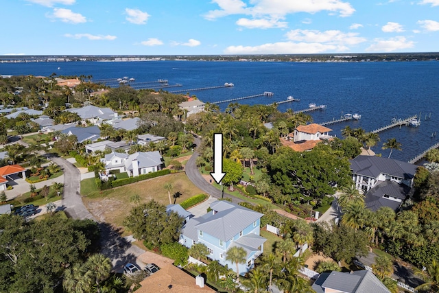 drone / aerial view featuring a water view and a residential view
