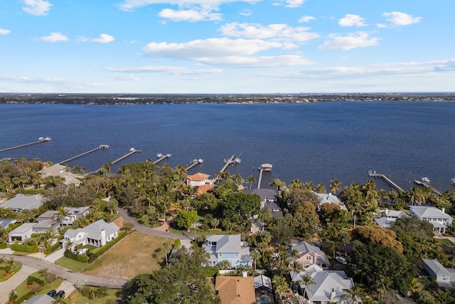 drone / aerial view featuring a residential view and a water view