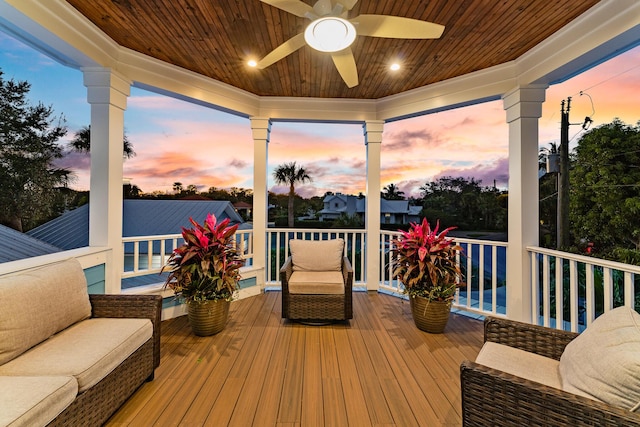 sunroom / solarium featuring wood ceiling and ceiling fan