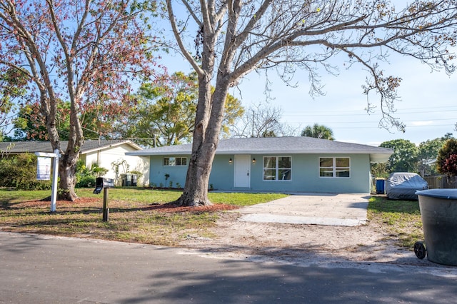 ranch-style house with a front lawn