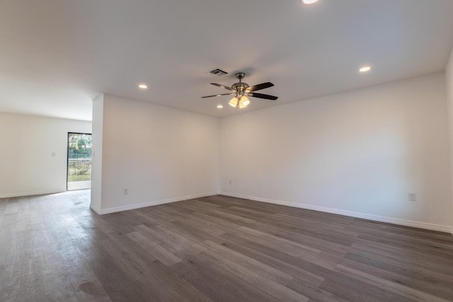 unfurnished room with dark hardwood / wood-style floors and ceiling fan