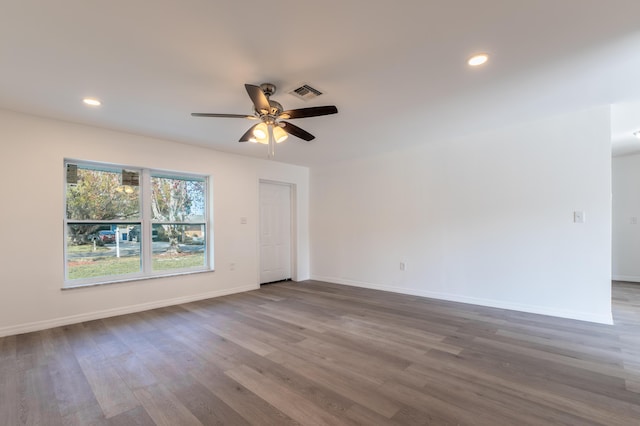 empty room featuring ceiling fan and wood-type flooring