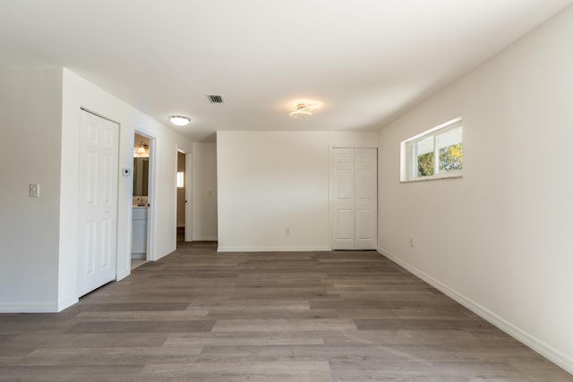 spare room featuring hardwood / wood-style flooring