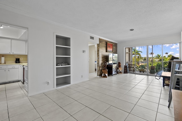 tiled living room featuring built in shelves, crown molding, and a textured ceiling