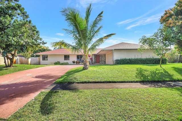 ranch-style house featuring a front lawn