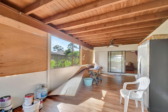 sunroom / solarium featuring wood ceiling, beam ceiling, and ceiling fan