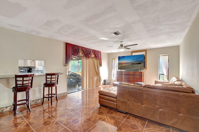 living room featuring ceiling fan