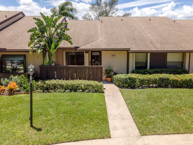 ranch-style home with a front yard