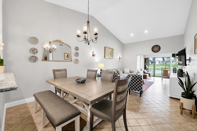 tiled dining space featuring high vaulted ceiling