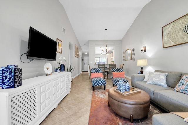 tiled living room featuring an inviting chandelier and high vaulted ceiling