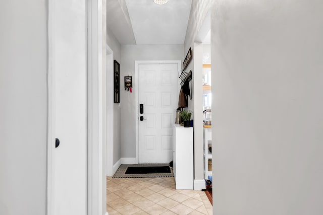 hallway featuring light tile patterned flooring