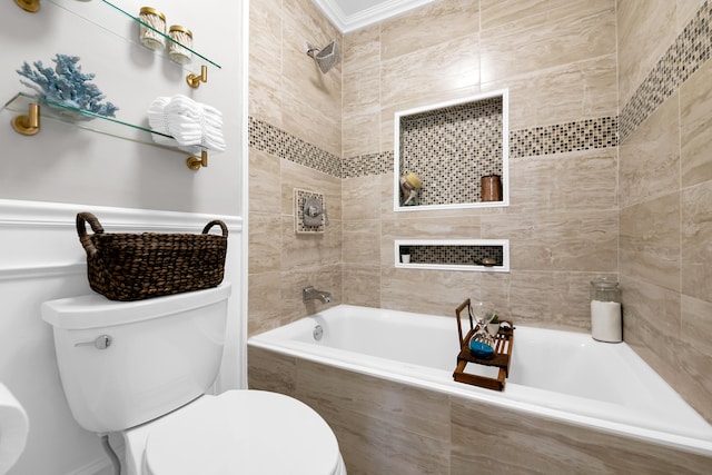 bathroom featuring tiled shower / bath, crown molding, and toilet