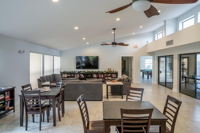 dining room featuring high vaulted ceiling