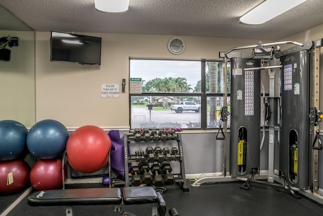 gym featuring a textured ceiling