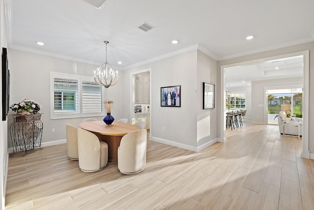 dining space with a chandelier, visible vents, light wood-style floors, and baseboards