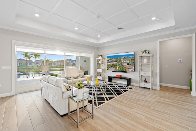 living room with coffered ceiling, wood finished floors, visible vents, baseboards, and crown molding