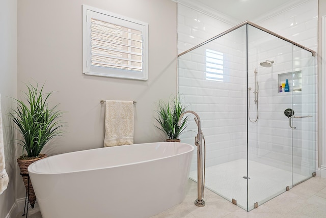 bathroom with a freestanding bath and a shower stall