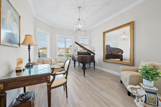 living area featuring light wood-type flooring, crown molding, baseboards, and a notable chandelier