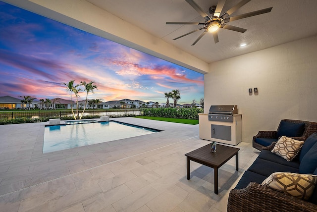 pool at dusk featuring a fenced in pool, a patio area, ceiling fan, exterior kitchen, and a fenced backyard