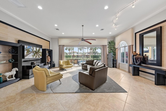 tiled living room with crown molding, track lighting, and ceiling fan