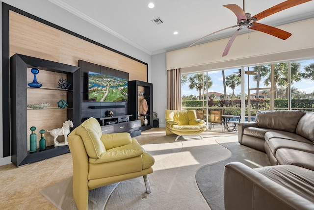 tiled living room with crown molding and ceiling fan