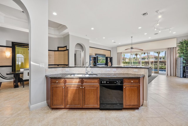 kitchen with crown molding, sink, decorative backsplash, and dark stone countertops