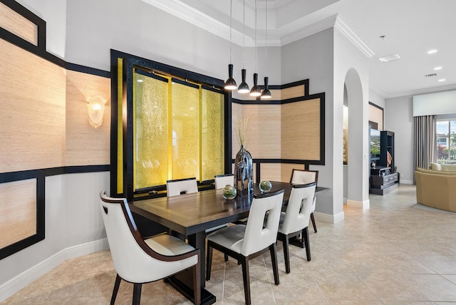 dining room featuring tile patterned flooring and crown molding