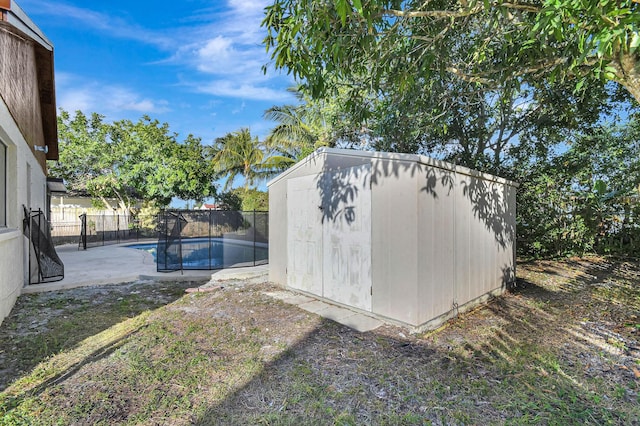 view of outdoor structure featuring a fenced in pool