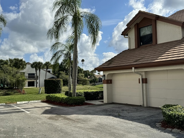 view of side of home featuring a yard