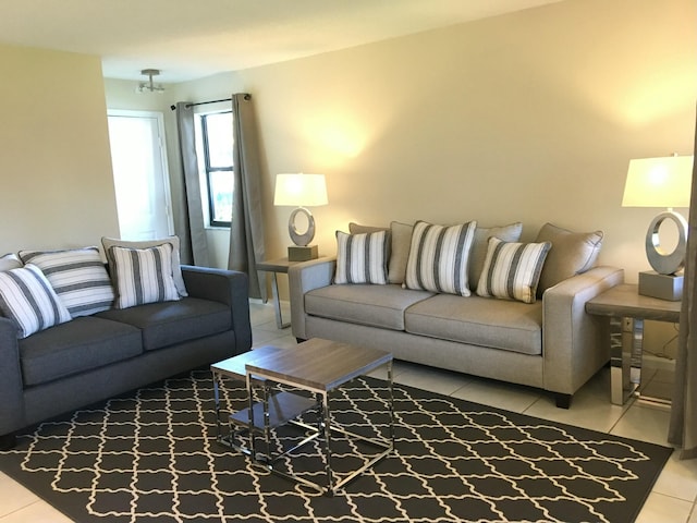 living room with light tile patterned flooring