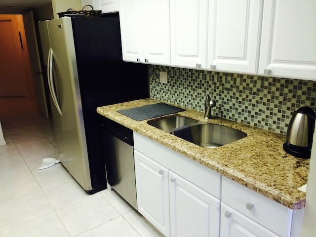 kitchen featuring white cabinetry, appliances with stainless steel finishes, and sink