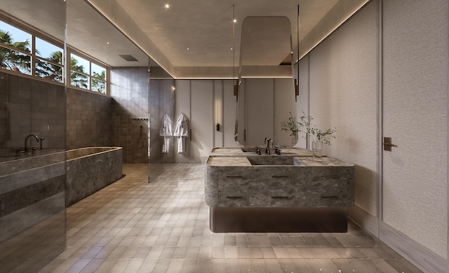 bathroom with a walk in shower, vanity, and tile patterned flooring