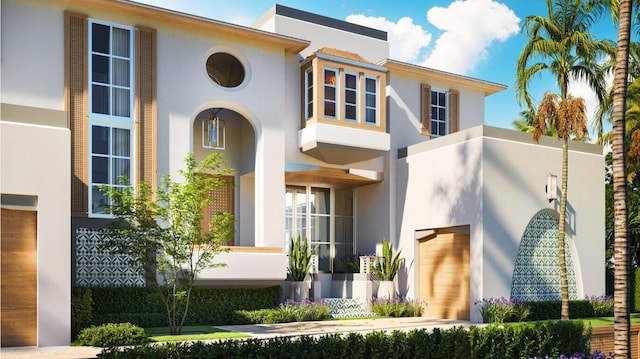 view of front of house featuring stucco siding and an attached garage