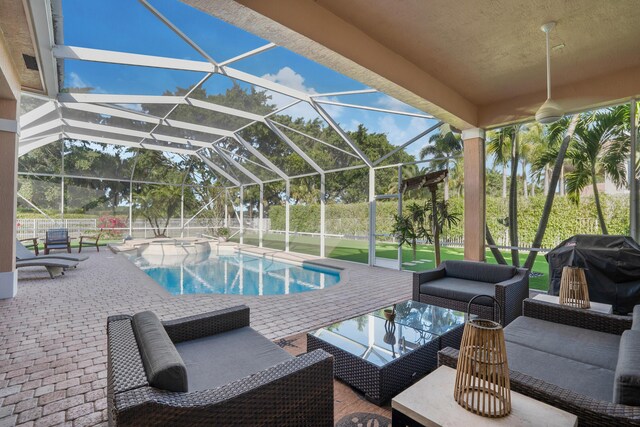 view of swimming pool featuring an outdoor living space, a patio, grilling area, and glass enclosure