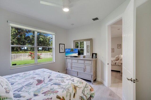 bedroom featuring light hardwood / wood-style flooring and ceiling fan