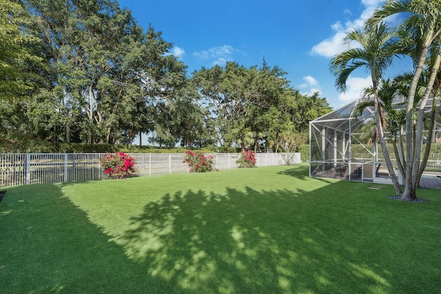 view of yard with a lanai