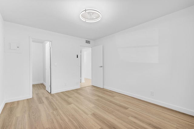 spare room with light wood-type flooring