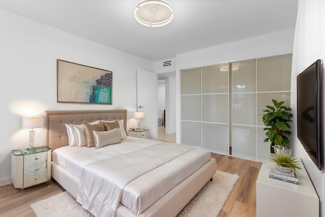 bedroom featuring light hardwood / wood-style floors