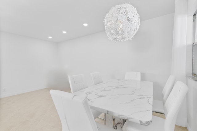 dining area with an inviting chandelier